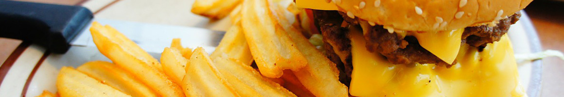 Eating Burger at Burger Hut restaurant in Chico, CA.